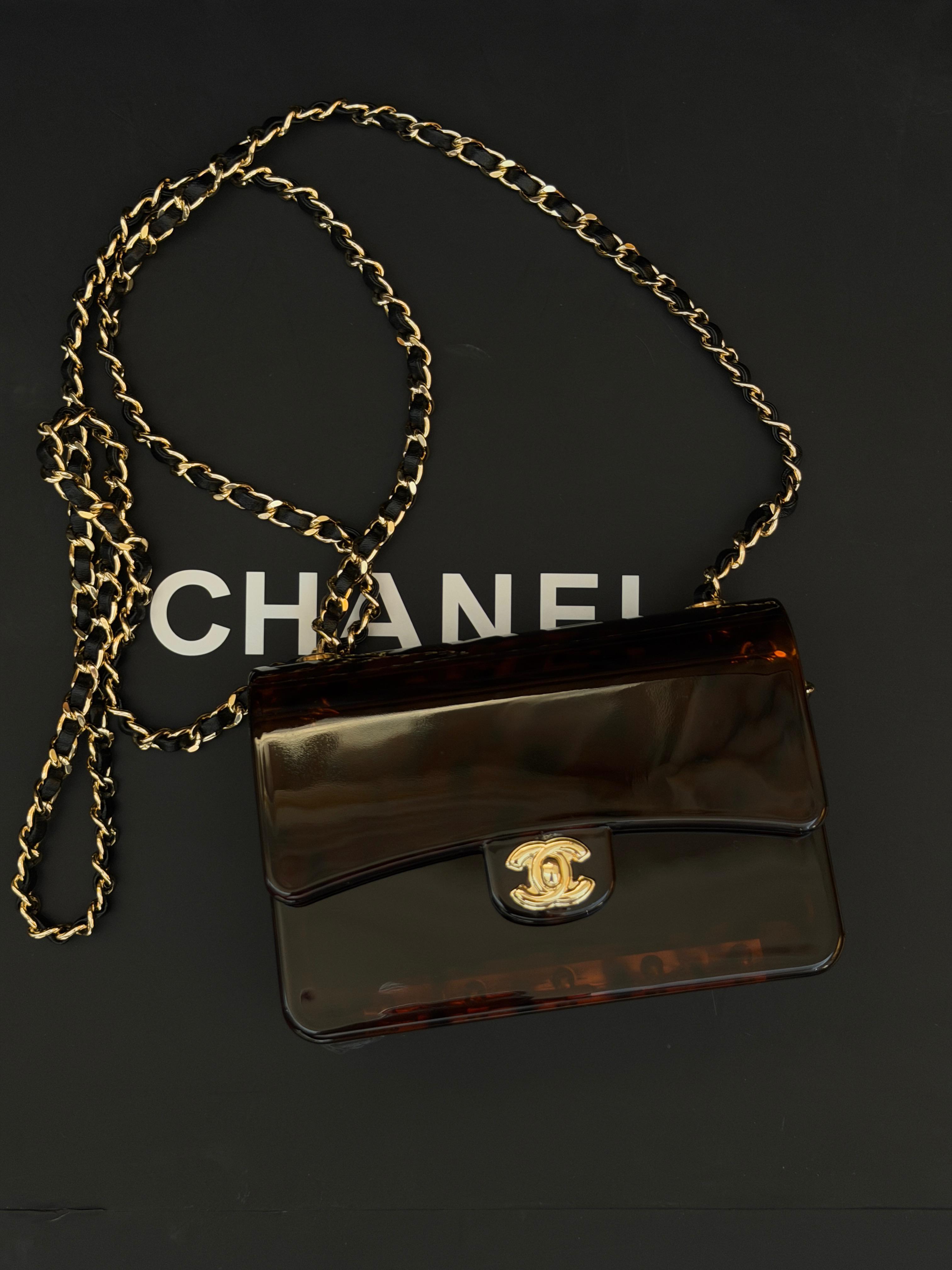 Chanel Mini Evening Bag
Tortoiseshell-patterned plexiglass body and gold-tone chain strap
